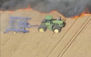 This INTENSE Video Shows A Farmer Risking His Life To Stop A Wildfire From Consuming His Entire Farm