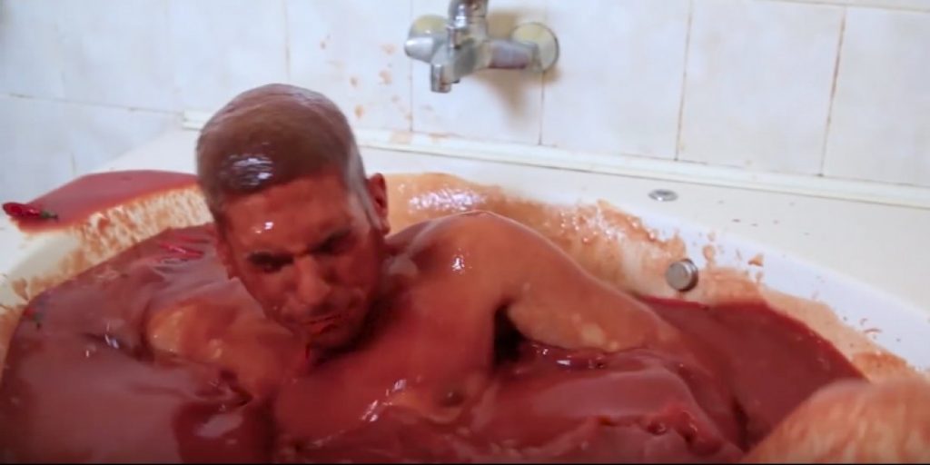 Watch This Dumbass Dive Into A Bathtub Of HOT SAUCE And Chili Peppers!